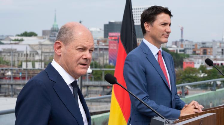 August 22, 2022, Montreal, PQ, Canada: German Chancellor Olaf Scholz responds to a question during a joint news confere