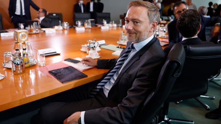 German Finance Minister Christian Lindner waits prior to the weekly cabinet meeting on August 24, 2022 at the Chancellery in Berlin. (Photo by Odd ANDERSEN / AFP)