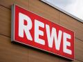 Stettenhofen, Bavaria, Germany - 31 May 2022: Rewe German supermarket logo on the facade of the food retail store *** Re