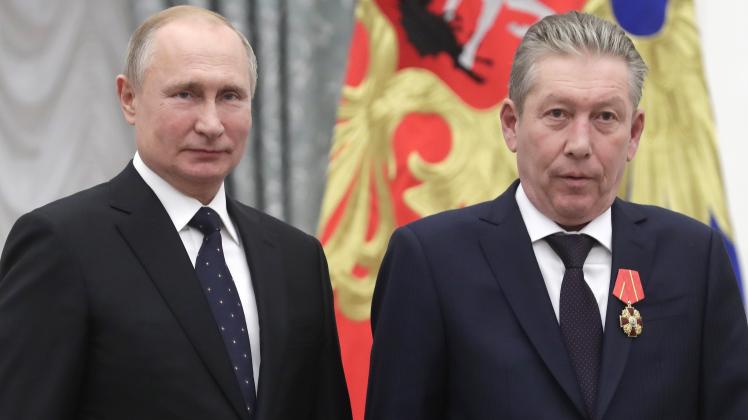 MOSCOW, RUSSIA   NOVEMBER 21, 2019: Russia s President Vladimir Putin (L) awards an Order of Alexander Nevsky to Lukoil