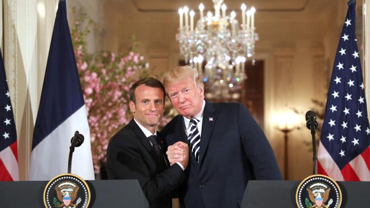 (FILES) In this file photo taken on April 24, 2018, US President Donald Trump and French President Emmanuel Macron hold a joint press conference at the White House in Washington, DC. - Macron said will seek second term in French election in April, on March 03, 2022. (Photo by Ludovic MARIN / AFP)