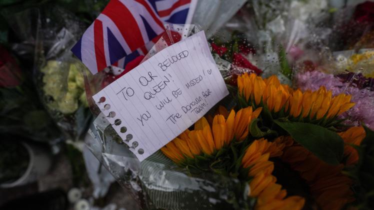 Mourners pay their respects at Buckingham Palace after the passing of Her Majesty The Queen A note to Our Beloved Queen,