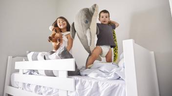 Portrait Of Children Playing With Toys In Bunk Bed model released Symbolfoto property released PU