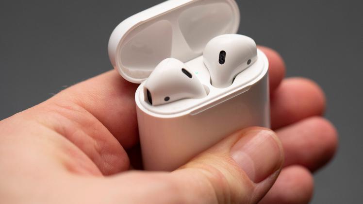 Vilnius/Lithuania February 10, 2020 Comparison Apple AirPods wireless Bluetooth headphones and wired headphones Apple iP