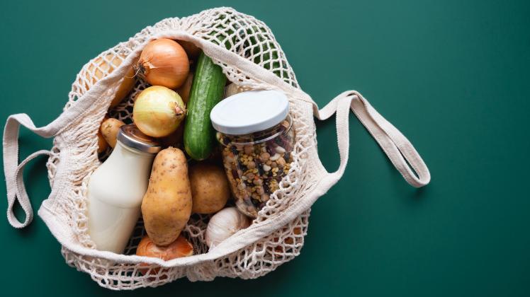 Vegetables, milk and beans in a shopping bag