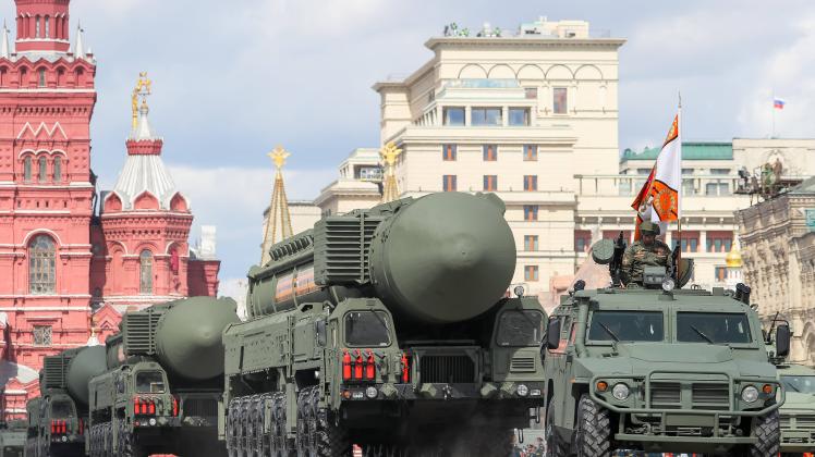MOSCOW, RUSSIA - MAY 7, 2021: A Tigr-M SpN armored vehicle (front) and a Yars mobile intercontinental ballistic missile