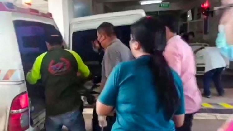 This frame grab from video footage by Thai PBS made available via AFPTV and taken on October 6, 2022 shows medical staff carrying a stretcher out of an ambulance in the northern Thai province of Nong Bua Lam Phu, where a former policeman shot dead at least 30 people in a nursery. - A former police officer stormed a nursery in Thailand on October 6, shooting dead at least 30 people, most of them children, before killing himself and his family. (Photo by various sources / AFP) / -----EDITORS NOTE --- RESTRICTED TO EDITORIAL USE - MANDATORY CREDIT "AFP PHOTO / THAI PBS via AFPTV" - NO MARKETING - NO ADVERTISING CAMPAIGNS - DISTRIBUTED AS A SERVICE TO CLIENTS  - NO ARCHIVES