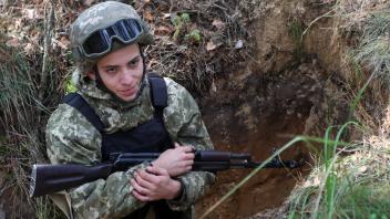 CHERNIHIV REGION, UKRAINE - AEPTEMBER 30, 2022 - Soldier Mykola Loza poses for a photo during the training of Ukrainian