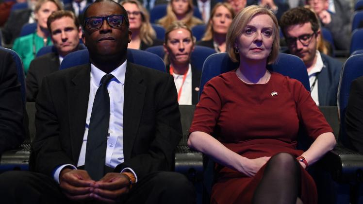 (FILES) In this file photo taken on October 2, 2022 Britain&apos;s Chancellor of the Exchequer Kwasi Kwarteng (L) and Britain&apos;s Prime Minister Liz Truss (R) attend the opening day of the annual Conservative Party Conference in Birmingham, central England. - Kwarteng has been sacked, the BBC and Sky News reported on October 14, 2022 quoting unnamed sources, as Truss tries to save her beleaguered premiership. (Photo by Oli SCARFF / AFP)