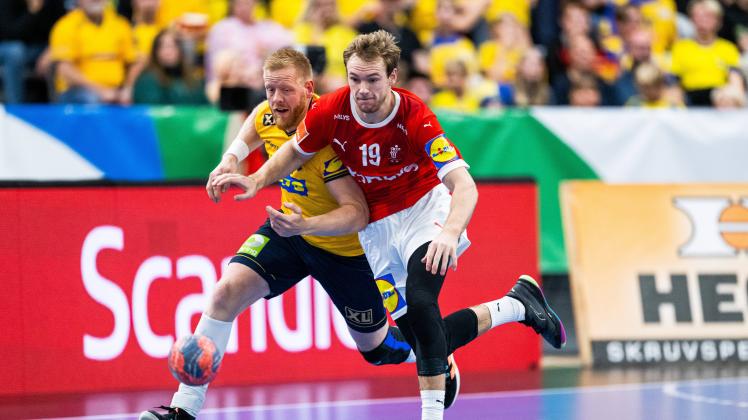 221016 Mathias Gidsel of Denmark and Jim Gottfridsson of Sweden during the EHF Euro Cup handball match between Sweden a