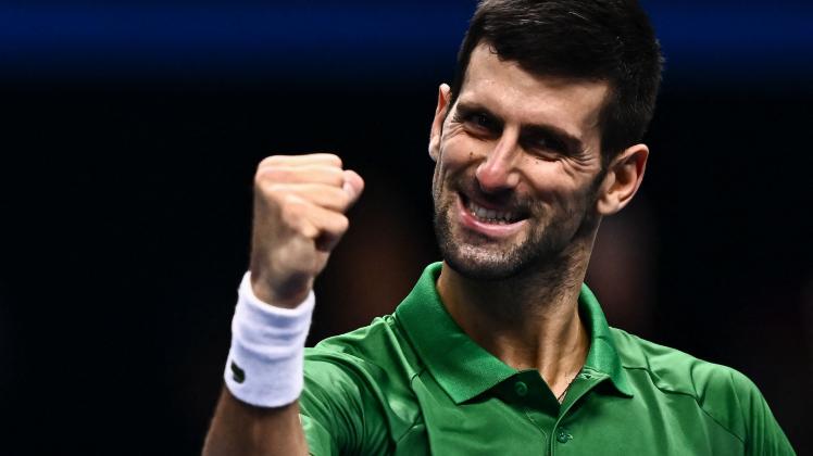 TOPSHOT - Serbia&apos;s Novak Djokovic celebrates after winning his first round-robin match against Greece&apos;s Stefanos Tsitsipas at the ATP Finals tennis tournament on November 14, 2022 in Turin. (Photo by Marco BERTORELLO / AFP)