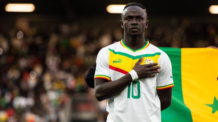 ORLEANS, FRANCE - SEPTEMBER 24: Sadio Mane of Senegal look on as the national anthems are played during the Internation