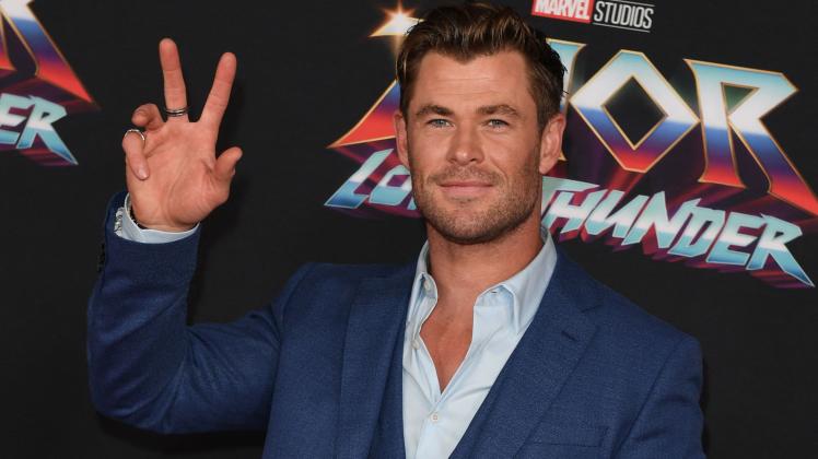 (FILES) In this file photo taken on June 23, 2022, Australian actor Chris Hemsworth arrives for Marvel Studios "Thor: Love And Thunder" world premiere at the El Capitan theatre in Los Angeles, California. - Marvel&apos;s latest superhero flick "Thor: Love and Thunder" pounded opponents for a second straight week to top the North American box office with an estimated $46 million haul, industry watcher Exhibitor Relations reported on July 17, 2022. (Photo by VALERIE MACON / AFP)