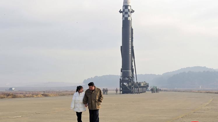 This photo released on Nov. 19, 2022, by the North Korean government shows North Korean leader Kim Jong Un, (L) inspects