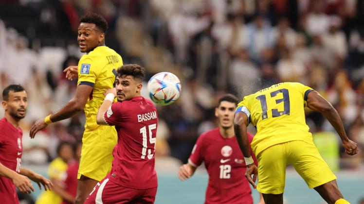 Ecuador&apos;s forward #13 Enner Valencia (R) scores his team&apos;s second goal during the Qatar 2022 World Cup Group A football match between Qatar and Ecuador at the Al-Bayt Stadium in Al Khor, north of Doha on November 20, 2022. (Photo by KARIM JAAFAR / AFP)