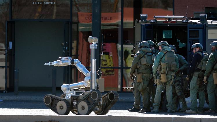 January 14, 2020, Albuquerque, NM, USA: The robot heads into the building at 4414 Menaul Blvd. NE to