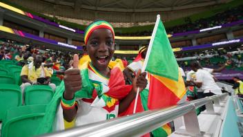Al Thumama Stadium DOHA, QATAR - NOVEMBER 21: Young kid of Senegal celebrates before the FIFA World Cup, WM, Weltmeister