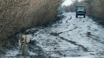 December 9, 2022, Bakhmut, Donetsk, Ukraine: A Russian rocket lies in a road with mud after the rain near the outskirts