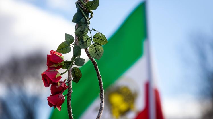 Protest against executions in Iran A noose adorned with roses hangs from a gallows during a rally against the Islamic r