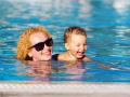Mother and daughter in the pool, Happy mother and little daughter in the pool model released, Symbolfoto , 04.02.2020 21