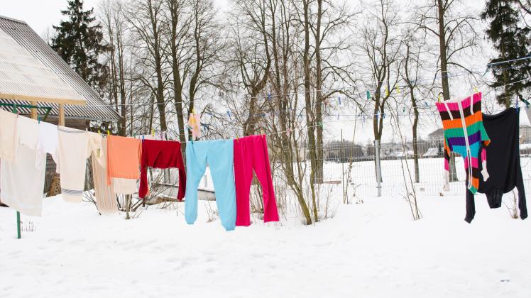 RECORD DATE NOT STATED colorful washed wet clothes loundry dry hang on rope in house yard in winter. , 8750154.jpg, wash