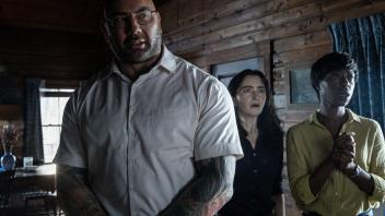 (from left) Leonard (Dave Bautista), Adriane (Abby Quinn) and Sabrina (Nikki Amuka-Bird) in Knock at the Cabin, directed by M. Night Shyamalan. 