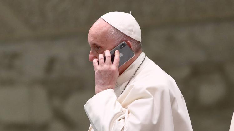 Pope Francis speaks on the phone during the General Audience in the Paul VI Hall. Vatican City (Vatican), August 11th, 2