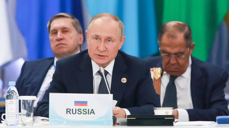 Kazakhstan. Astana. OCTOBER 13, 2022. Russia s President Vladimir Putin (front), President Putin s adviser Yuri Ushakov