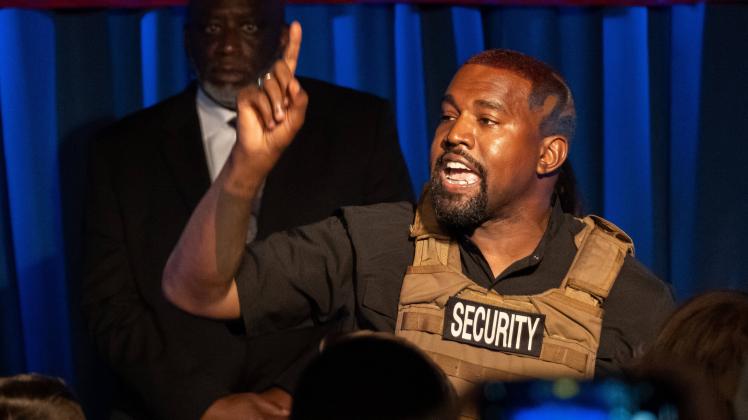 American rapper and entrepreneur Kanye West, wearing a bulletproof vest, addresses supporters during his first campaign