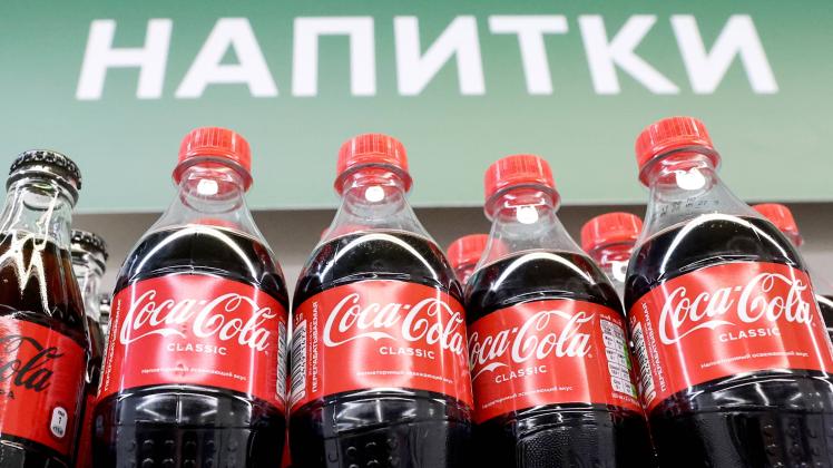 MOSCOW, RUSSIA   JUNE 16, 2022: Bottles with Coca-Cola soda drink. The Coca-Cola HBC AG company, which includes manufact