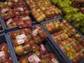 Illustration picture shows apples wrapped in plastic during a so called plastic attack at a superma