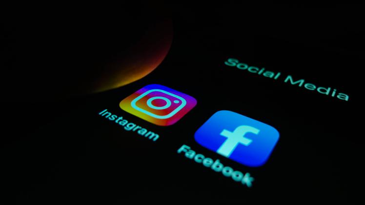 February 19, 2023, Asuncion, Paraguay: A view of a finger about to touch Instagram app icon next to Facebook app icon on