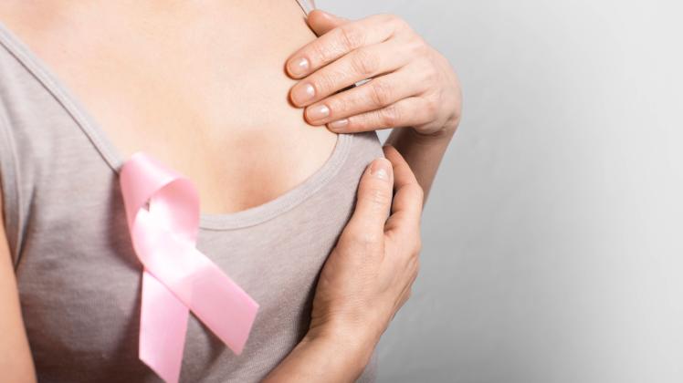 Middle aged caucasian woman doing breast self examination Middle aged caucasian woman doing breast self examination Copy