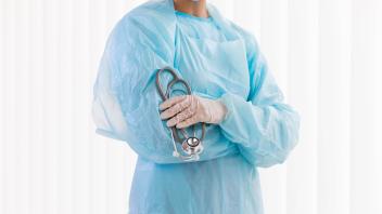 front view female doctor wearing protective clothing. High quality photo front view female doctor wearing protective clo