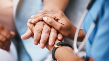 Empathy, trust and nurse holding hands with patient for help, consulting support and healthcare advice. Kindness, counse