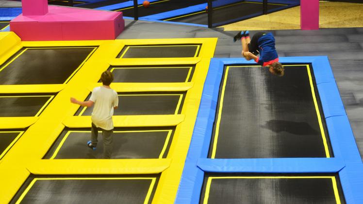 (171208) -- LJUBLJANA, Dec. 8, 2017 () -- Boys jump on trampoline at WOOP Trampoline Park in Ljubljana, Slovenia, Dec 7, 2017. Covering an area of 3,500 square meters, the park has more than 100 trampolines. (/Matic Stojs)(zjl). (Matic Stojs/Photoshot)