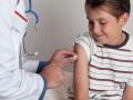 A child receives an immunisation or vaccination shot from a friendly doctor or healthcare worker. Copyright: xLeahxThomp