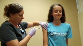 April 12, 2023: A nurse administers a dose of the HPV vaccine at an Illinois health clinic in 2018. A California lawmake