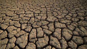 March 22, 2023, Malaga, Spain: The cracked ground of the La Vinuela reservoir is seen before a protest against climate c