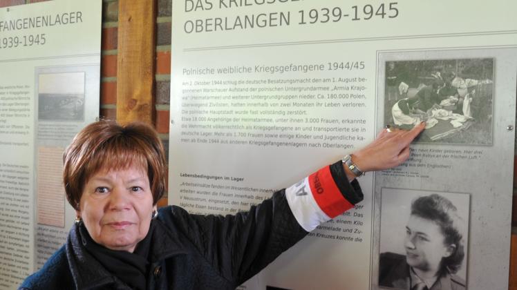 „Das bin ich“, sagt Hanna Strzelecka-Kociniak und zeigt auf ein Foto im Gedenkpavillon in Oberlangen, auf dem sie als Baby zu sehen ist.