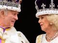Britain&apos;s King Charles III (L) looks at Queen Camilla as they stand on the Buckingham Palace balcony, in London, following their coronations, on May 6, 2023. - The set-piece coronation is the first in Britain in 70 years, and only the second in history to be televised. Charles will be the 40th reigning monarch to be crowned at the central London church since King William I in 1066. Outside the UK, he is also king of 14 other Commonwealth countries, including Australia, Canada and New Zealand. Camilla, his second wife, will be crowned queen alongside him, and be known as Queen Camilla after the ceremony. (Photo by Leon Neal / POOL / AFP)