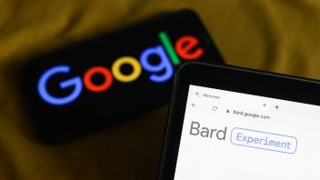 Bard Photo Illustrations Google logo displayed on a phone screen and Bard website displayed on a laptop screen are seen 