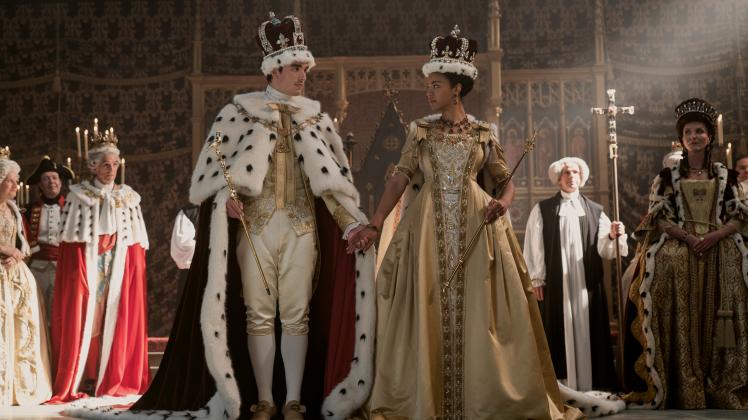 Queen Charlotte: A Bridgerton Story. (L to R) Corey Mylchreest as Young King George, India Amarteifio as Young Queen Charlotte, Michelle Fairley as Princess Augusta in episode 103 of Queen Charlotte: A Bridgerton Story. Cr. Liam Daniel/Netflix © 2023