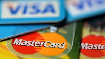 February 17, 2023, Prague, Czech Republic: Illustration photo of a MASTERCARD and VISA logo on a credit card. The size o