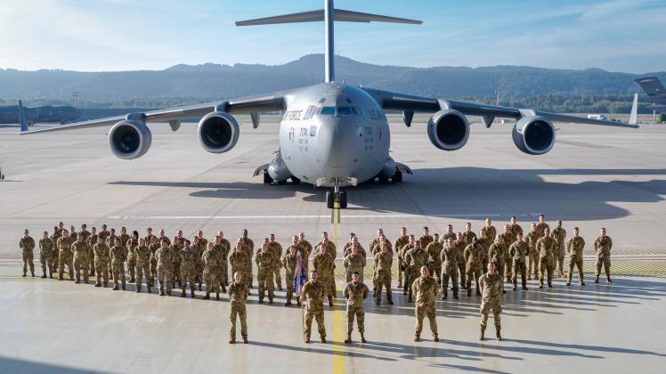 U.S. Air Force Airmen assigned to the 10th Expeditionary Aeromedical Evacuation Flight pose for a unit photo, Sept. 12,
