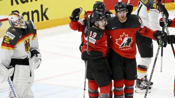 Goalkeeper Mathias Niederberger of Germany and team of Canada celebrates 2-2 goal made by Lawson Crouse (67) during the 