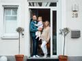 Happy family standing at front door model released, Symbolfoto property released, MOEF04487