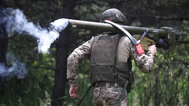 MAY 25, 2023: A serviceman of the Russian Central Military District fires an Igla portable surface-to-air missile system