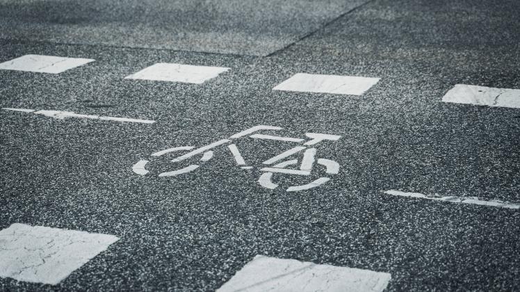 Kiel, Schleswig-Holstein, Germany - 8 July 2023: Marking of a cycle path on the carriageway - cycle path symbol on aspha