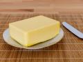 A piece of butter for breakfast, , 27.01.2021, Copyright: xheckex Panthermedia29378636.jpg